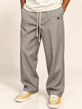 Noah – graue Hose mit Kordelzug und Bügelfalte, Detailansicht von Taille bis Saum