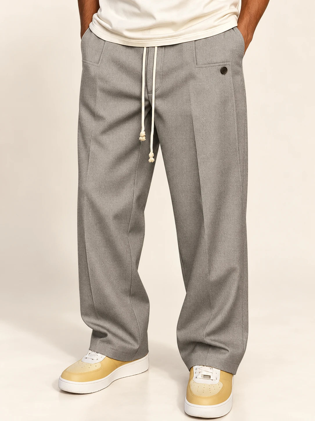 Noah – graue Hose mit Kordelzug und Bügelfalte, Detailansicht von Taille bis Saum